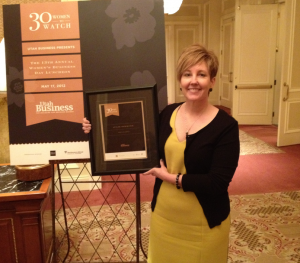 Julie from Marketstar receiving an award in a picture frame